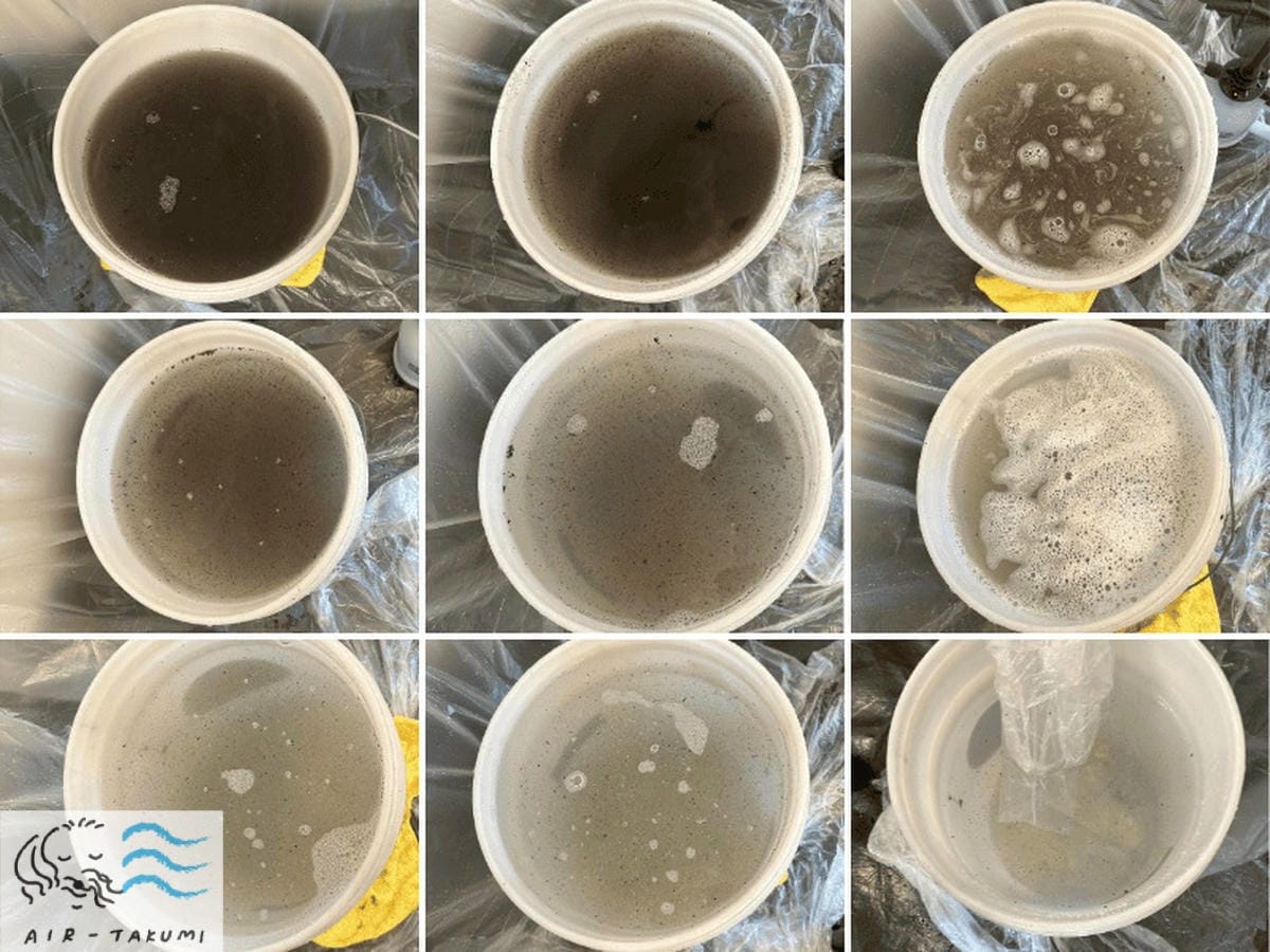 バケツに溜まった真っ黒な排水